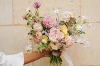 a small pastel wedding bouquet