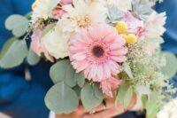 a pastel wedding bouquet of white dahlias, roses, pink gerberas, billy balls and eucalyptus is a cool idea for spring