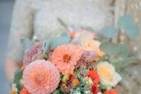 a peach and coral wedding bouquet with dahlias, roses and muted greenery is a lovely idea for a summer wedding with orange and peachy tones