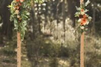 a simple and stylish rustic wedding arch of branches, greenery, white, rust and burgundy blooms and deep purple touches