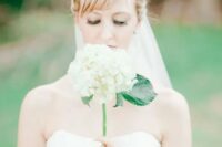 a cute single stem wedding bouquet