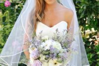 a spring wedding bouquet of lilac roses and fillers, white dahlias and gerberas and greenery is a very delicate and chic idea