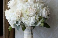 a stylish wedding bouquet of blush roses and white hydrangeas and greenery is a lovely idea for spring and summer