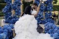 a wedding rotonda fully done with bold blue and navy hydrangeas and the aisle lined up with them, too, looks jaw-dropping