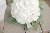 a white hydrangeas wedding bouquet with eucalyptus is a chic rustic idea for a bride