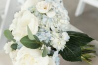 a white peony and blue hydrangea wedding bouquet with some leaves is a stylish idea for spring and summer