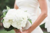 a white rose and hydrangea wedding bouquet with a bit of leaves is a lovely idea for spring or summer