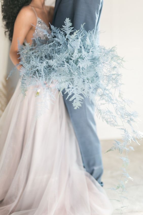 dusty miller spray painted pastel blue is a lovely idea for a spring or summer wedding