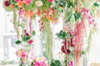 jaw-dropping secret garden wedding centerpieces of greenery and lots of colorful blooms, from bottom to the top are fantastic
