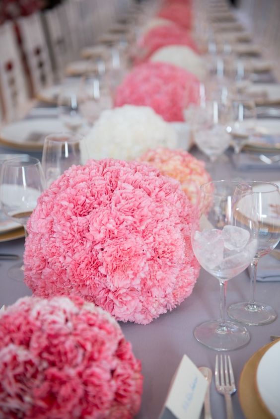 pink and white carnation sphere wedding centerpieces are great to add interest to the table