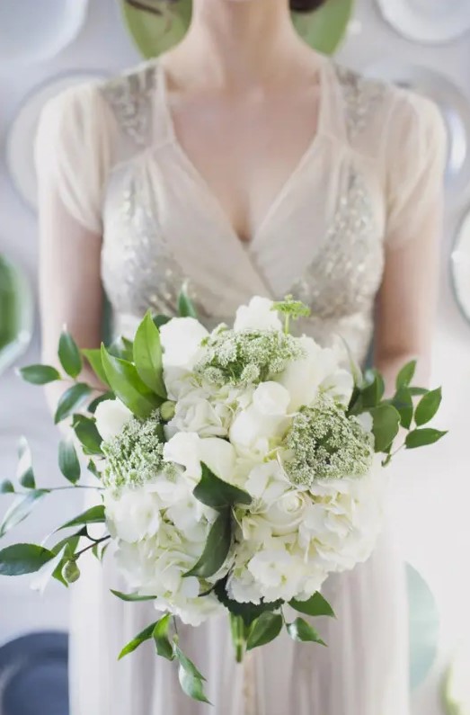 white roses, hydrangeas, smaller blooms and greenery for an elegant and beautiful bridal bouquet