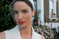 03 a birdcage veil with a white headband is a modern and bold idea for a refined bride