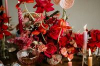 04 a beautiful and sumptuous wedding centerpiece with blush, red and orange blooms and blooming branches is a gorgeous idea