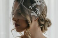 05 a birdcage veil with floral applique is a gorgeous and refined idea for a bride who wants a modern take on a classic accessory