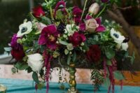 06 a sumptuous wedding centerpiece of white roses and anemones, burgundy roses and callas, greenery and amaranthus for the fall