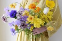 09 a colorful wedding bouquet of mimosa, poppies and other blooms done in purple and yellow is all about color blocking