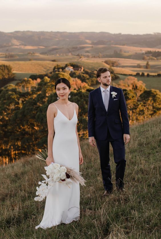 a classic plain slip wedding dress with a V-neckline and straps will never go out of style and is a great idea for a modern or minimalist bride