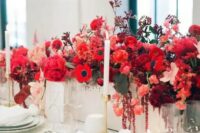 12 a bold red floral centerpiece – a box with bright blooms and leaves and some neutral candles for a chic look