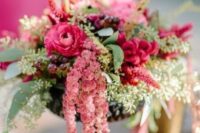 14 a bright wedding centerpiece of pink blooms, greenery, grapes, amaranthus is a super chic and cool idea for a summer wedding