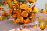 15 a bold wedding centerpiece of marigolds, mums, orchids and roses is a very beautiful and exquisite idea for a summer or fall wedding