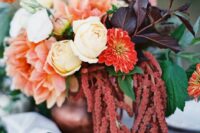 16 a fall wedding centerpiece of white roses, red mums, pink dahlias, dark foliage and greenery and amaranthus is a cool idea