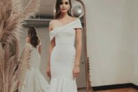 17 a bold and unusual one shoulder mermaid wedding dress with a layered skirt and a train is a fantastic solution to catch an eye