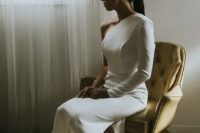18 a bold minimalist one shoulder wedding dress with a long sleeve paired with white and clear strap shoes are a perfect combo for a minimalist bride