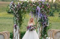 a natural-looking summer wedding arch