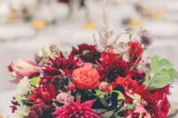 21 a bold wedding centerpiece of red dahlias, peony roses, amaranthus, greenery and grasses for a fall wedding