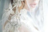 21 a sheer veil adorned with silver flower applique and crystals is a very sophisticated and beautiful idea