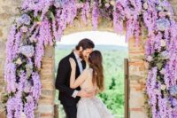 21 a wisteria wedding arch with roses and hydrangeas is a lovely idea for a spring or summer wedding