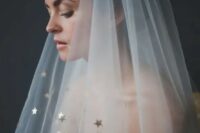 22 a sheer veil embellished with gold stars will be a great addition to a modern and glam celestial bridal look