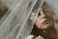 23 a silver star embellished veil will be a perfect accessory for a modern celestial bride, it looks chic and airy