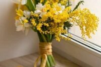 23 a spring wedding bouquet of white and yellow daffodils, mimosa and ribbon is a gorgeous idea for a bright wedding