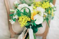24 a whimsy spring wedding bouquet of white and yellow ranunculus, mimosa, white fillers and greenery is amazing and cute