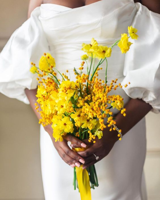 a yellow wedding bouquet with mimosa is a lovely and bright solution for a spring or summer wedding