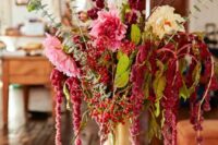 26 a bold wedding centerpiece of pink and white dahlias, blooming branches, amaranthus and berries for the fall