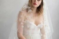 27 a subtle and beautiful wedding veil with white fabric blooms, gold embroidery and pearls and rhinestones is a lovely solution