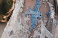 30 a beautiful embroidered and embellished wedding veil with crystals, sequins and blue birds is amazing for a wedding