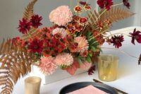 35 a super bright box wedding centerpiece with pink, rust and burgundy blooms, dried fern leaves looks spectacular