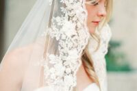38 a beautiful lace mantilla veil with floral applique is a refined and chic idea for a refined bride