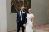 38 a modern plain wedding dress with a high neckline, short sleeves, cutout sides, a front slit and a train is a lovely idea for a modern wedding