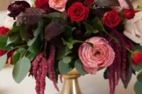 39 an elegant wedding centerpiece of white, pink and red roses, greenery and dark foliage, amaranthus is a super cool and chic idea