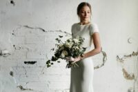 41 a timeless modern mermaid wedding dress of plain fabric, with a high neckline, short sleeves and a train is a lovely idea