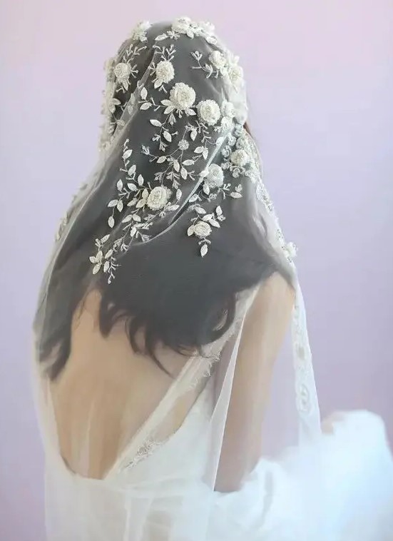 a gorgeous veil with realistic floral and leaf appliques of lace and beads for a romantic bride