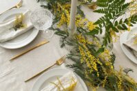 44 a spring wedding tablescape in neutrals, with a mimosa runner and white porcelain, neutral textiles and tall and thin candles