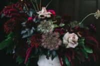 44 a vintage whitewashed vase with deep purple and burgundy blooms, pale roses, herbs and greenery