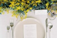 45 a stylish modern wedding table setting with a mimosa runner, grey porcelain, modern cutlery and elegant cards