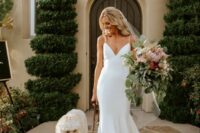 47 a classy modern plain mermaid wedding dress with a deep neckline, spaghetti straps and a train is a chic and timeless idea