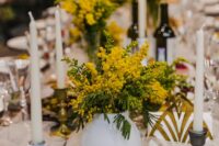 49 mimosa wedding centerpieces dotting the table will give it color and interest, try them out for a spring or summer wedding